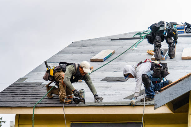 Professional Storm Damage Roof Repair technician working in Somers, NY